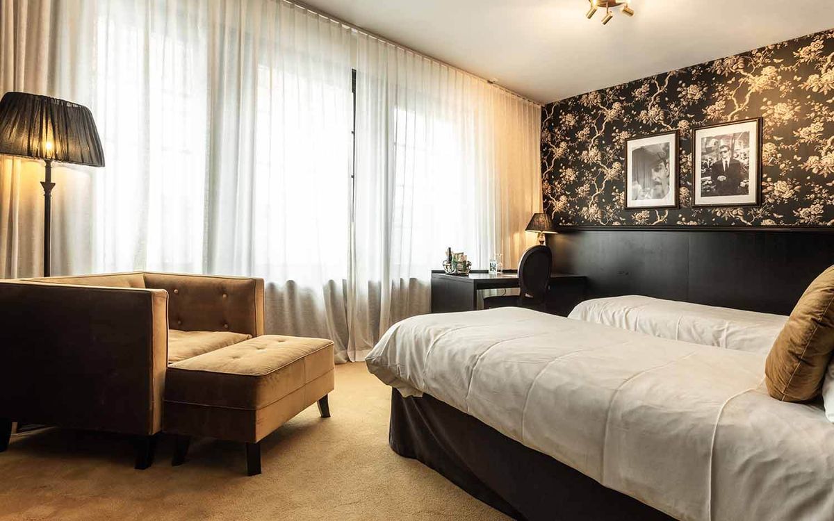 A smartly upholstered room at Hotel Bellora